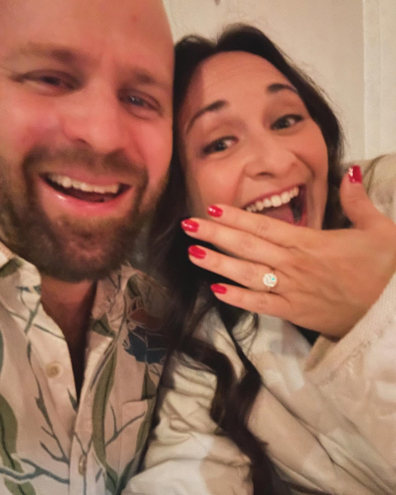 Amanda and Jordan celebrating their engagement, Amanda showing off the ring